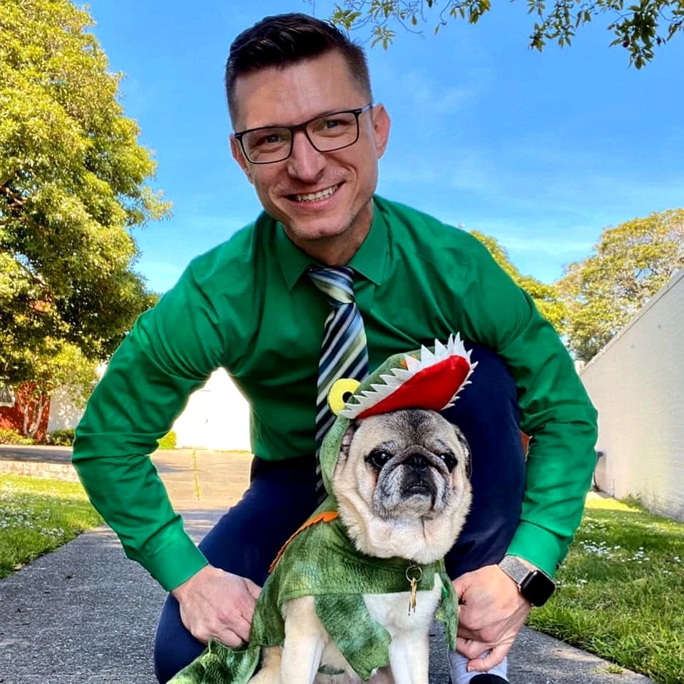 Mr. Cooper dressed as a gator beside Danny.
